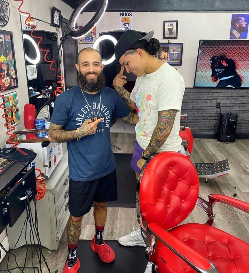 Inside Plan A Barbers with red barber chairs