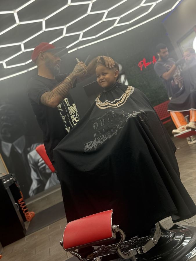 Barber at work at Plan A